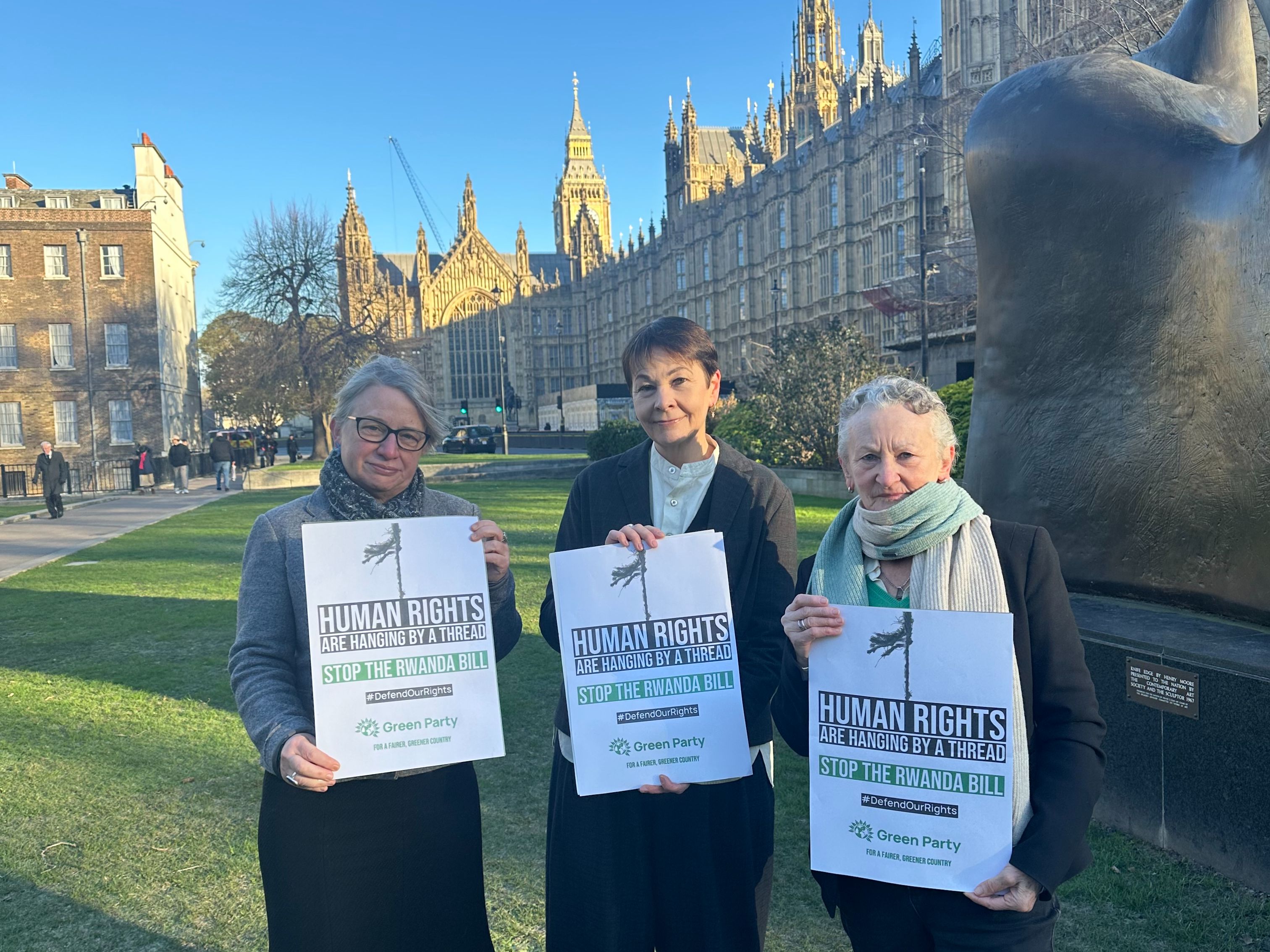 Photo of Natalie Bennett and Jenny Jones outside Parliament with text that reads:   Greens in the House.   With Green Party House of Lords logo in top right.