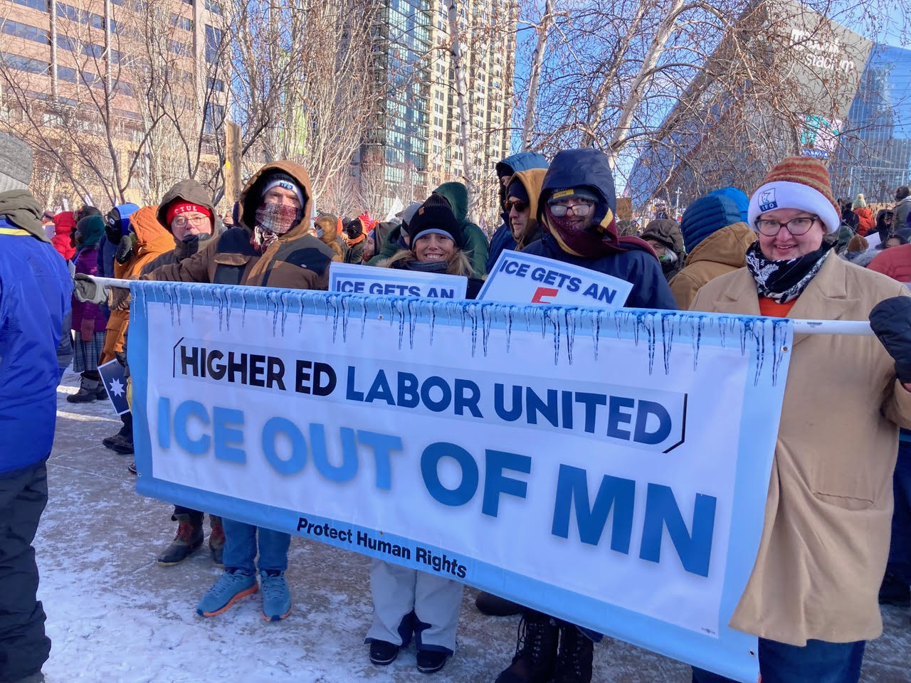 Minnesota higher ed workers march with HELU banner